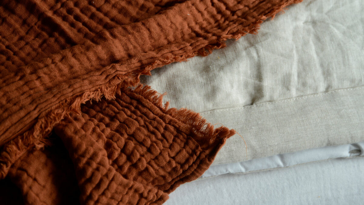 muslin crinkle throw in terracotta detail