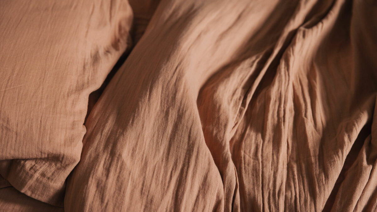 muslin look soft cotton bedding in clay pink shown close up