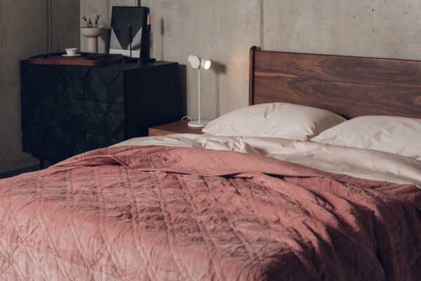dusky rose coloured velvet bedspread with stitched quilting