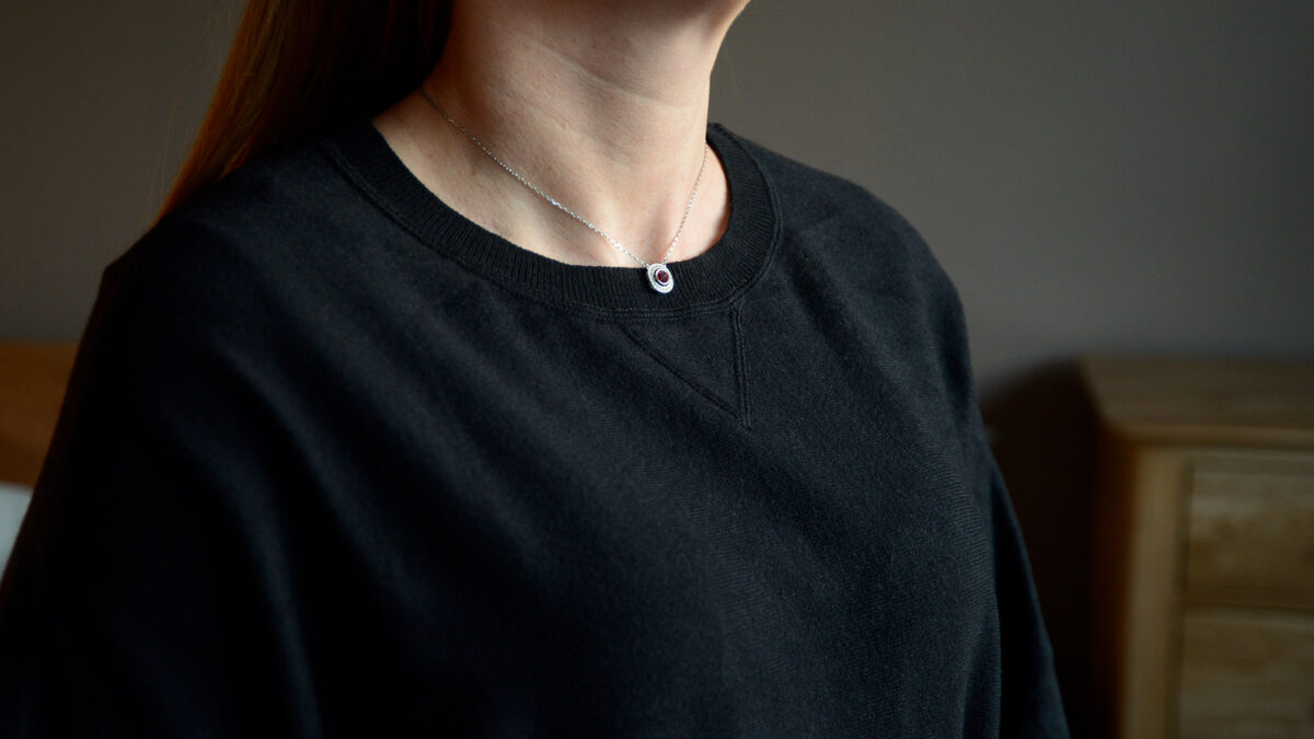 cosy black sweatshirt with batwing sleeves a close up of the neckline