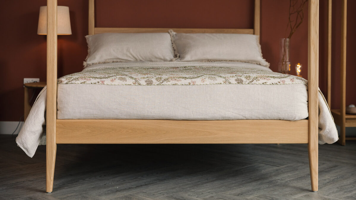 oak Canterbury bed with ecru linen and kantha throw
