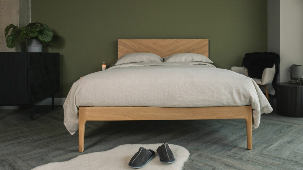 solid oak Highbury bed with a tall chevron patterned headboard