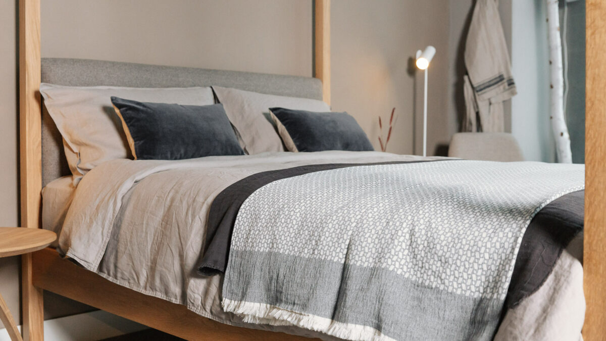 natural tones bedroom scheme featuring a solid oak Highland 4 poster bed