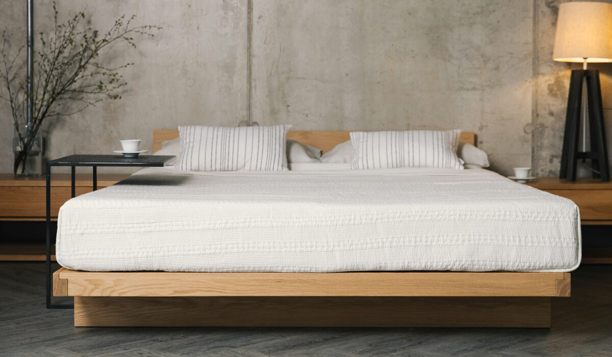 oak Kumo low bed with white kantha bedspread