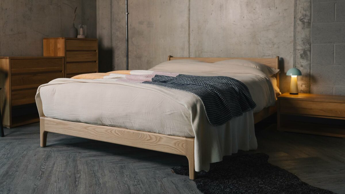 oak Pimlico bed with waffle throw in navy orange and pink