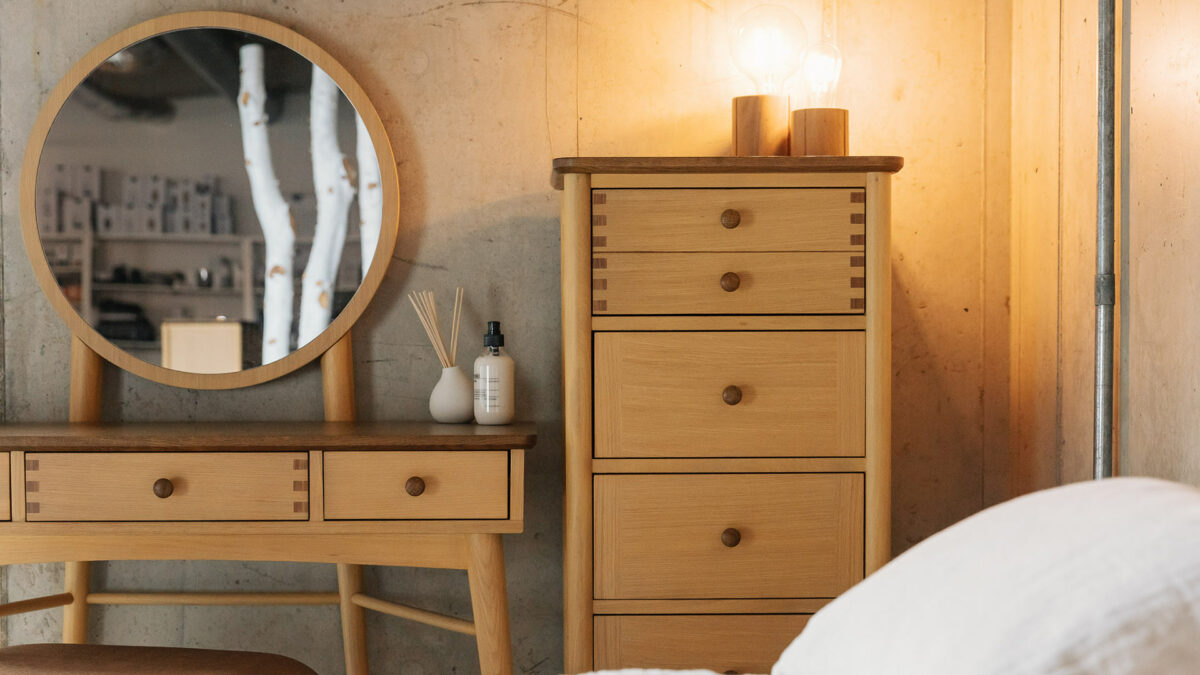 oak bedroom furniture with dark stain details dressing table and tallboy