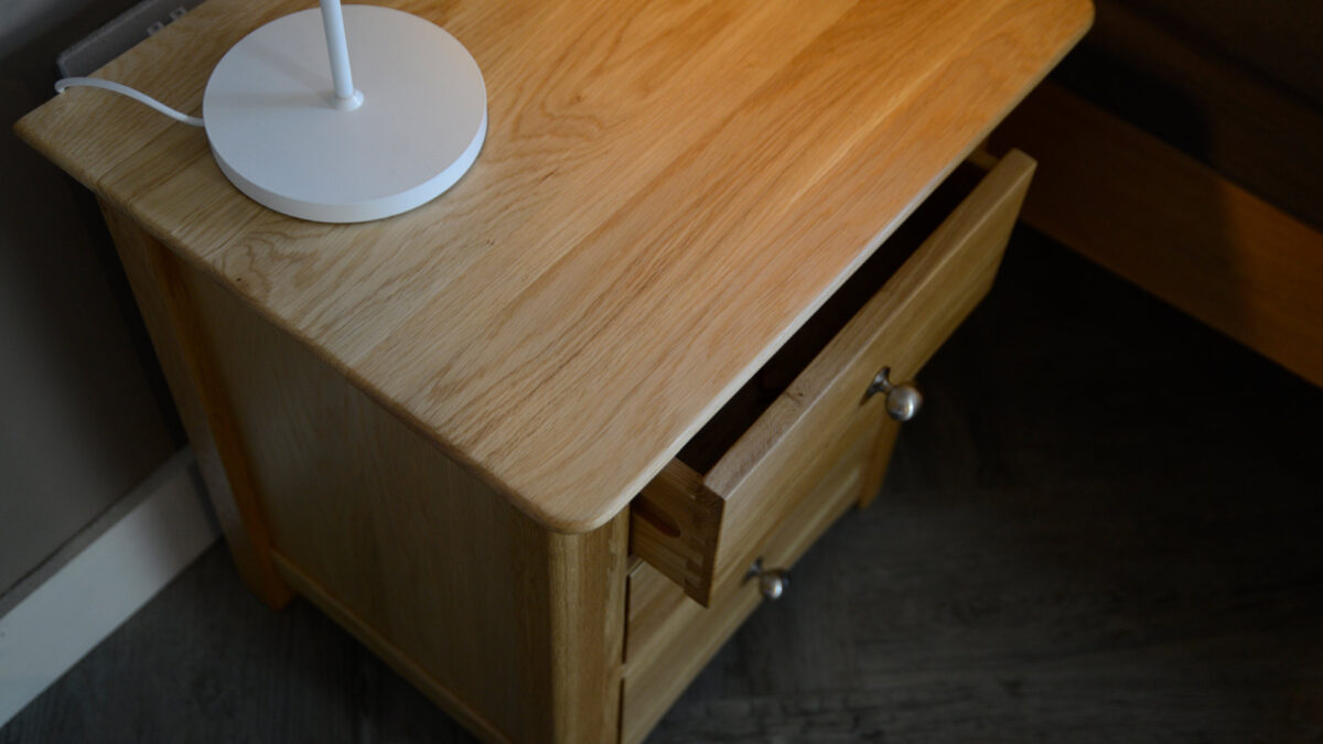 classic oak bedside table with 3 drawers shown from above