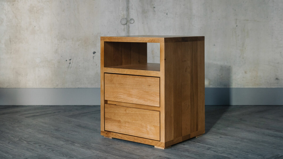 A Cube solid oak bedroom storage chest with 2 drawers and an open shelf