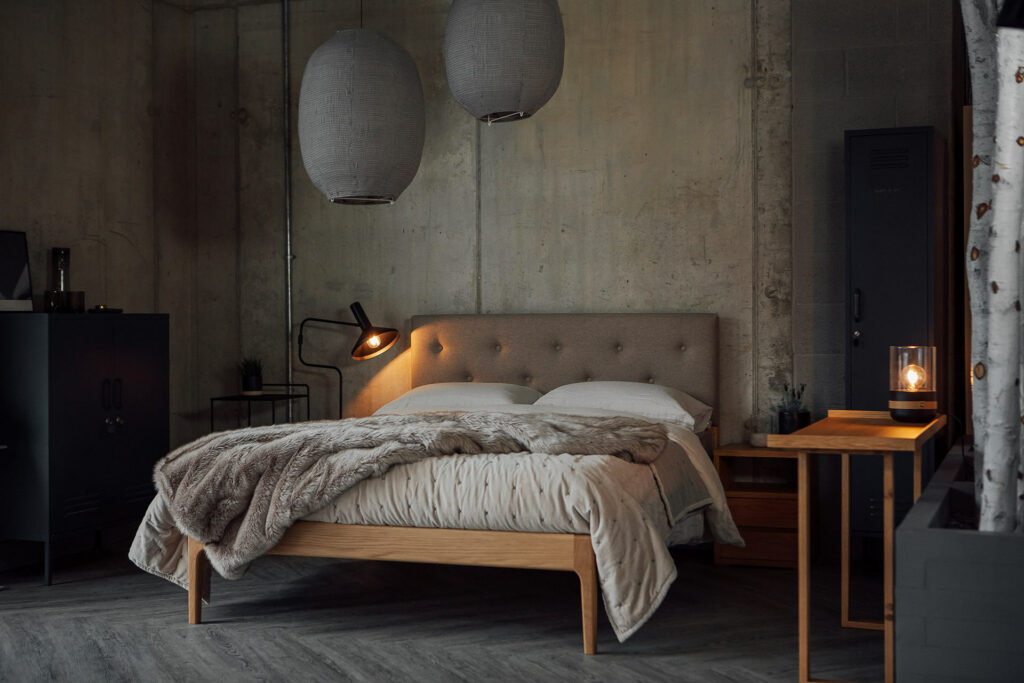 Industrial bedroom style made cosy with our upholstered headboard Bloomsbury bed in oak.