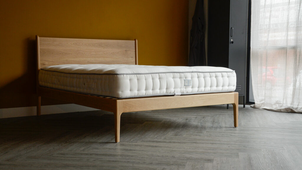 Our mid century style Camden bed made from solid oak wood and shown without bedding