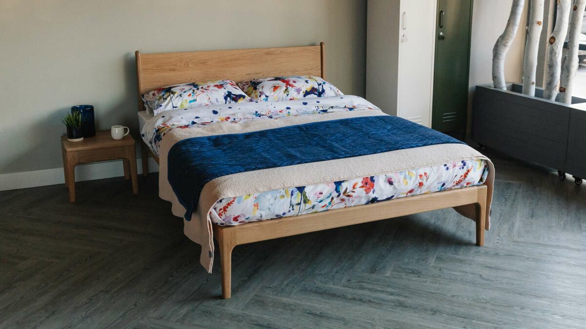 oak camden bed and side table with modern floral bedding
