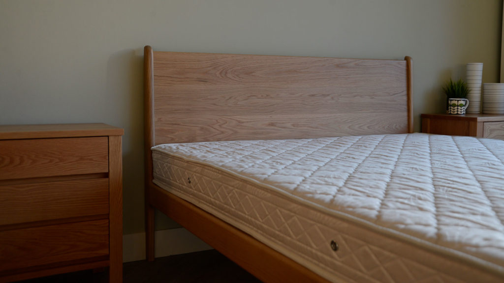 Our un-dressed Oak mid-century style Camden bed focus on the headboard