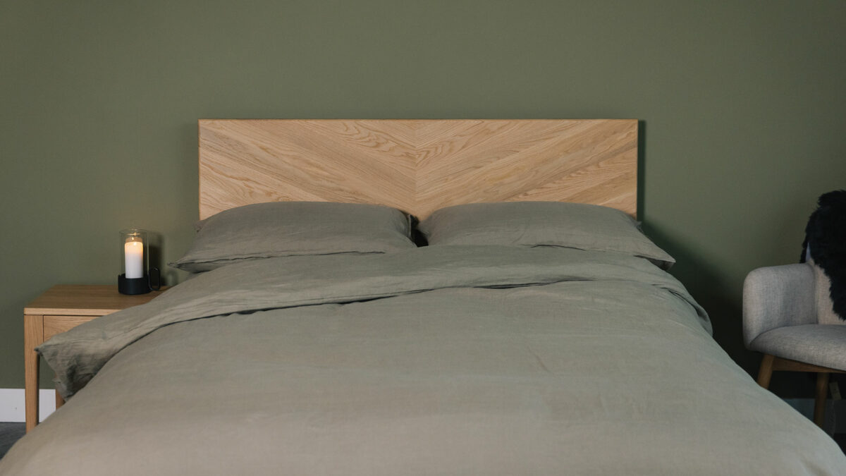 The Highbury bed has a solid wood headboard with chevron pattern here in oak