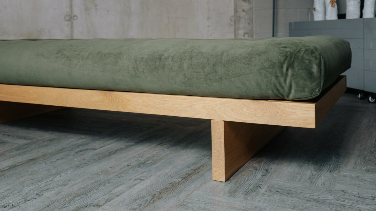 kyoto Daybed in solid oak with sprung mattress shown close up