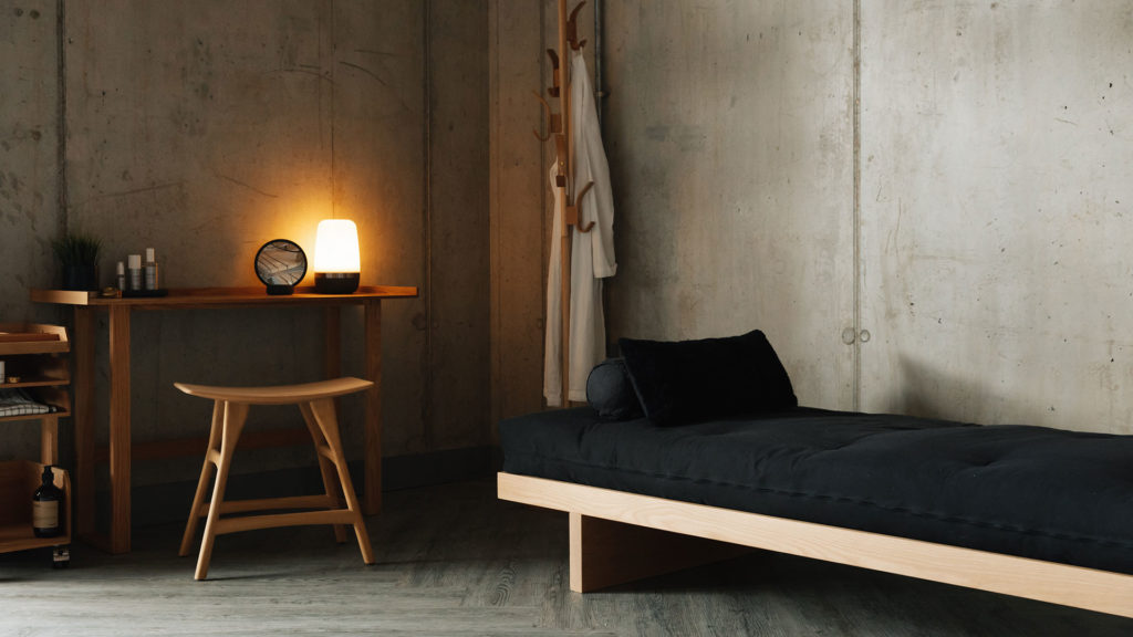 oak desk with osso stool and storage unit with daybed