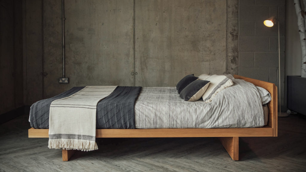 A side view of our solid wood Kyoto bed in Oak and with an optional Headboard. Available in a range of bed sizes.