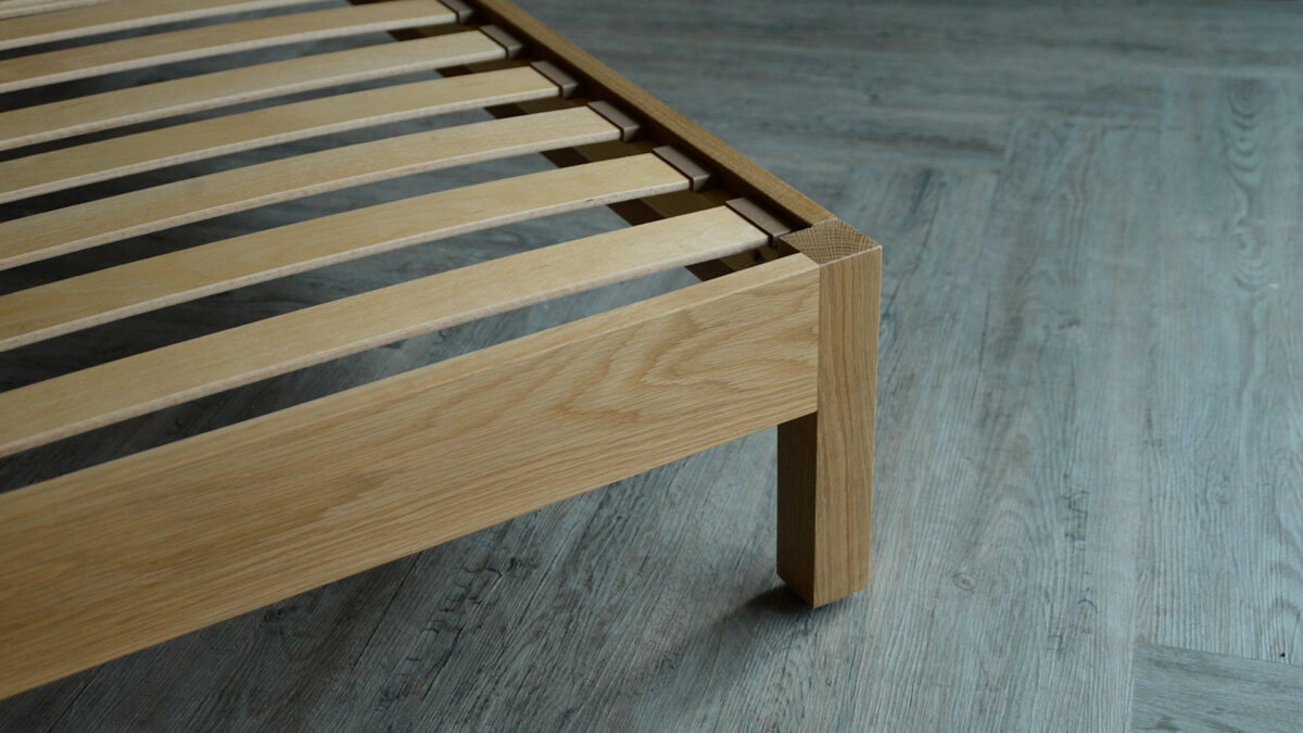 solid oak single bed a close up of the foot end leg and sprung slats