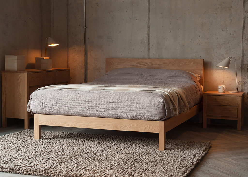 Oak bedroom storage drawers shown with our hand made oak wooden bed - The Malabar