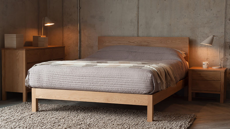 Oak bedroom storage drawers shown with our hand made oak wooden bed - The Malabar