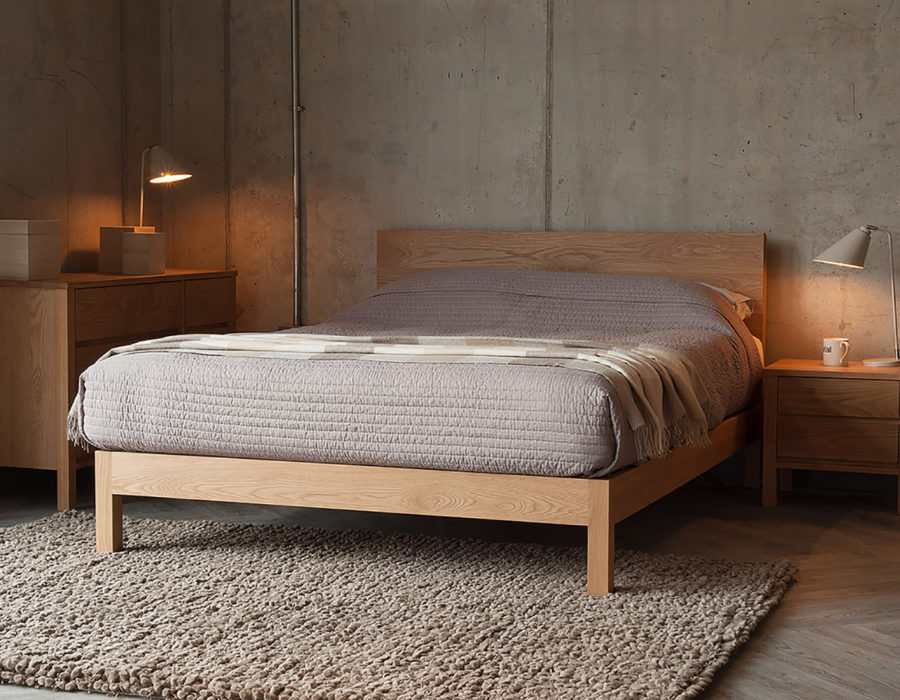 Oak bedroom storage drawers shown with our hand made oak wooden bed - The Malabar