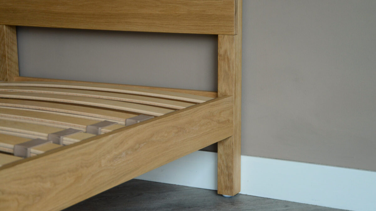 solid oak single Malabar bed a close up view of the side rail