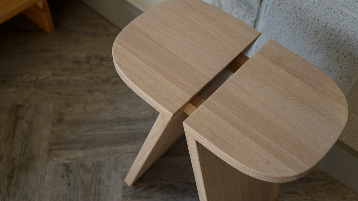 modern design oval topped side table in solid oak