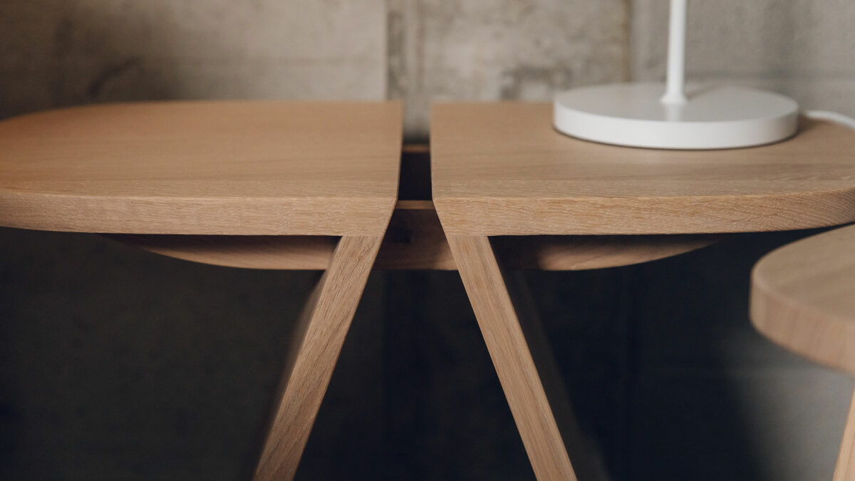 sculptural oak side table shown close up