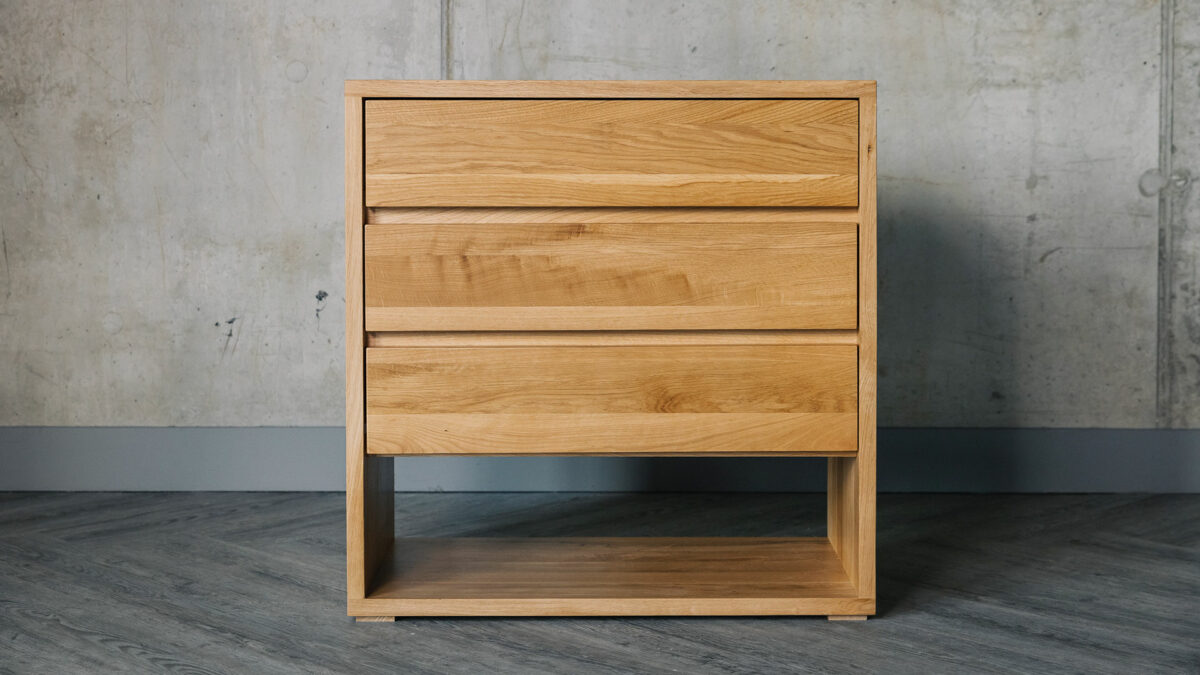 Bedroom storage chest with 3 drawers and open low shelf and made from solid oak