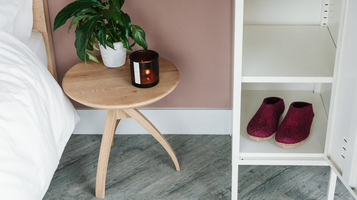 oak twist bedside table with cranberry slippers in mustard locker