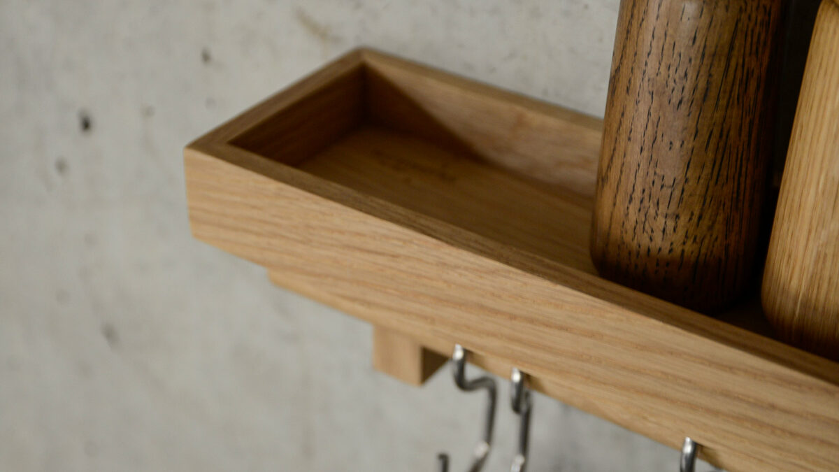 oak wall mounted storage shelf lip close up