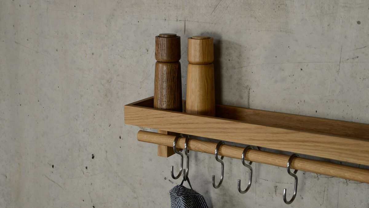 oak wall mounted storage shelf with stainless steel hooks