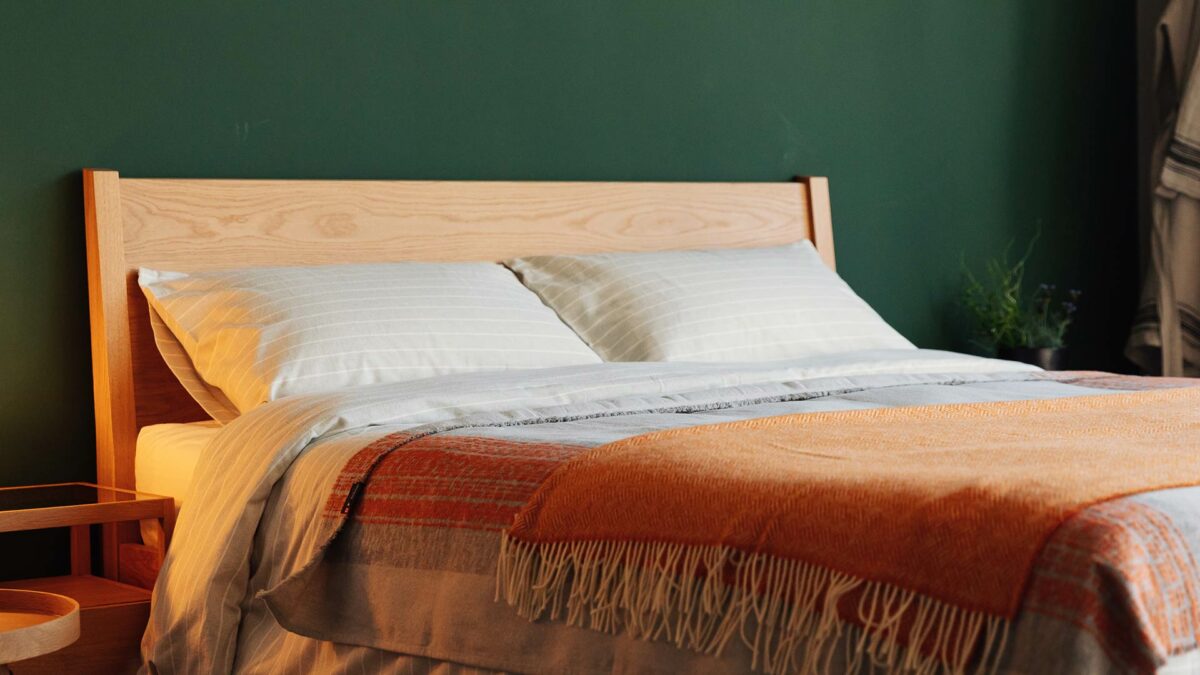 oak zanskar bed brushed cotton bedding and orange throws