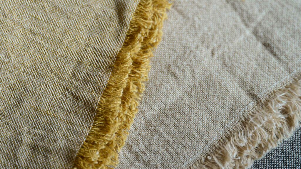 ochre and beige cotton and linen throws