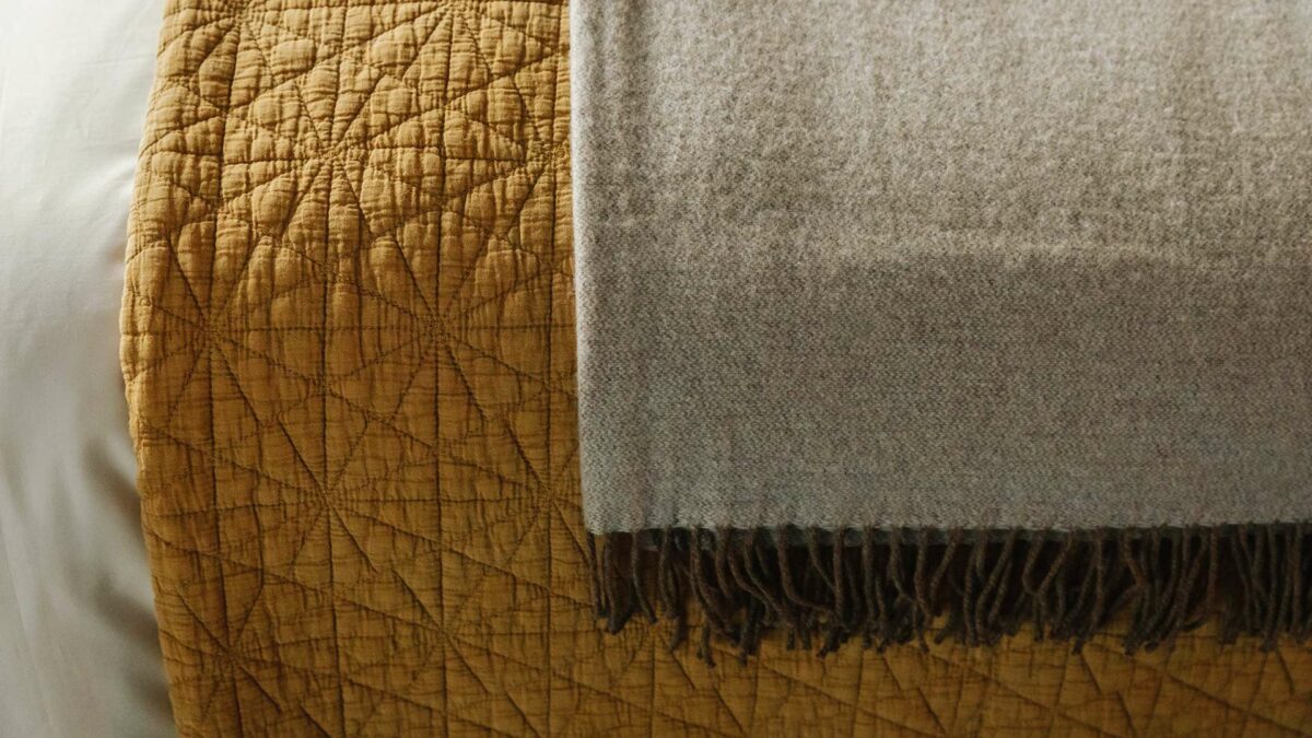 ochre hexagon bedspread and reversible Capuccino throw