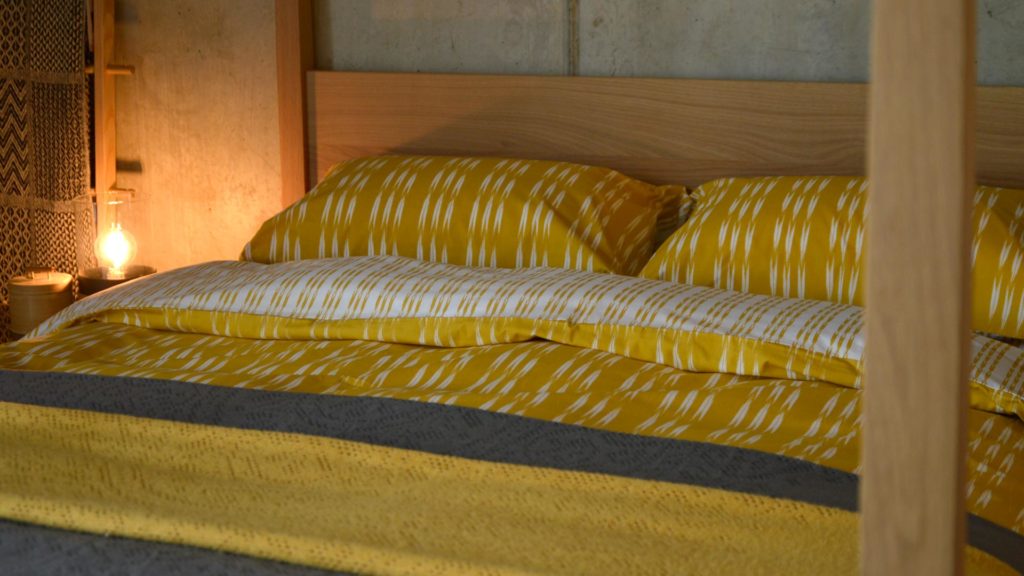 ochre-ikat-stripe-duvet-set-with-lace-throws