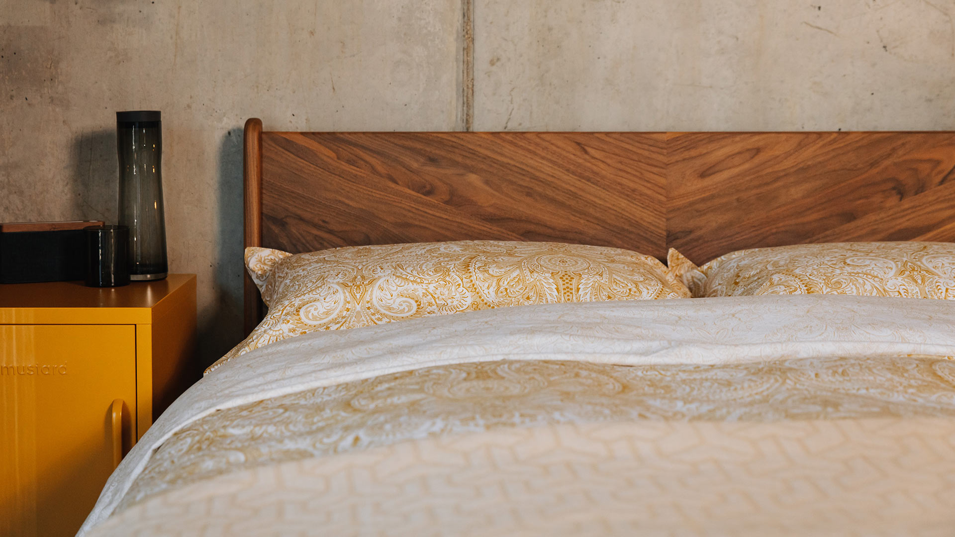 Hand crafted Hoxton bed in walnut with a chevron grain pattern