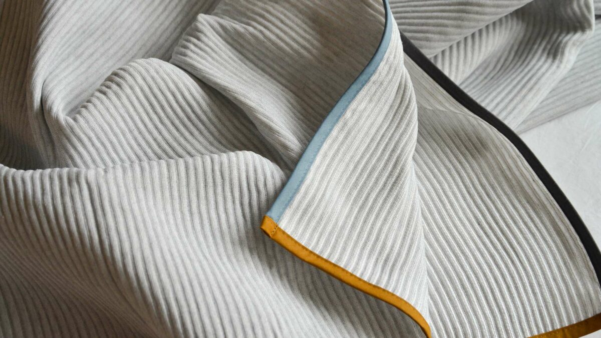 off white pale grey bedspread coloured edging