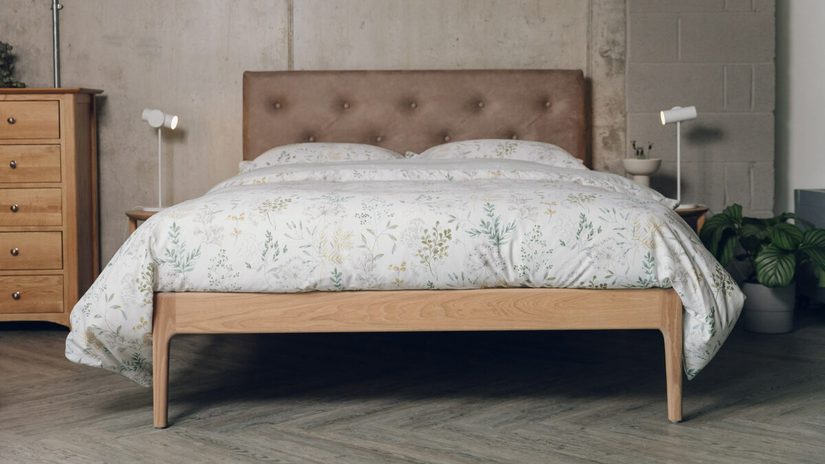 Oak Bloomsbury bed with an oiled frame and a headboard upholstered in a faux leather