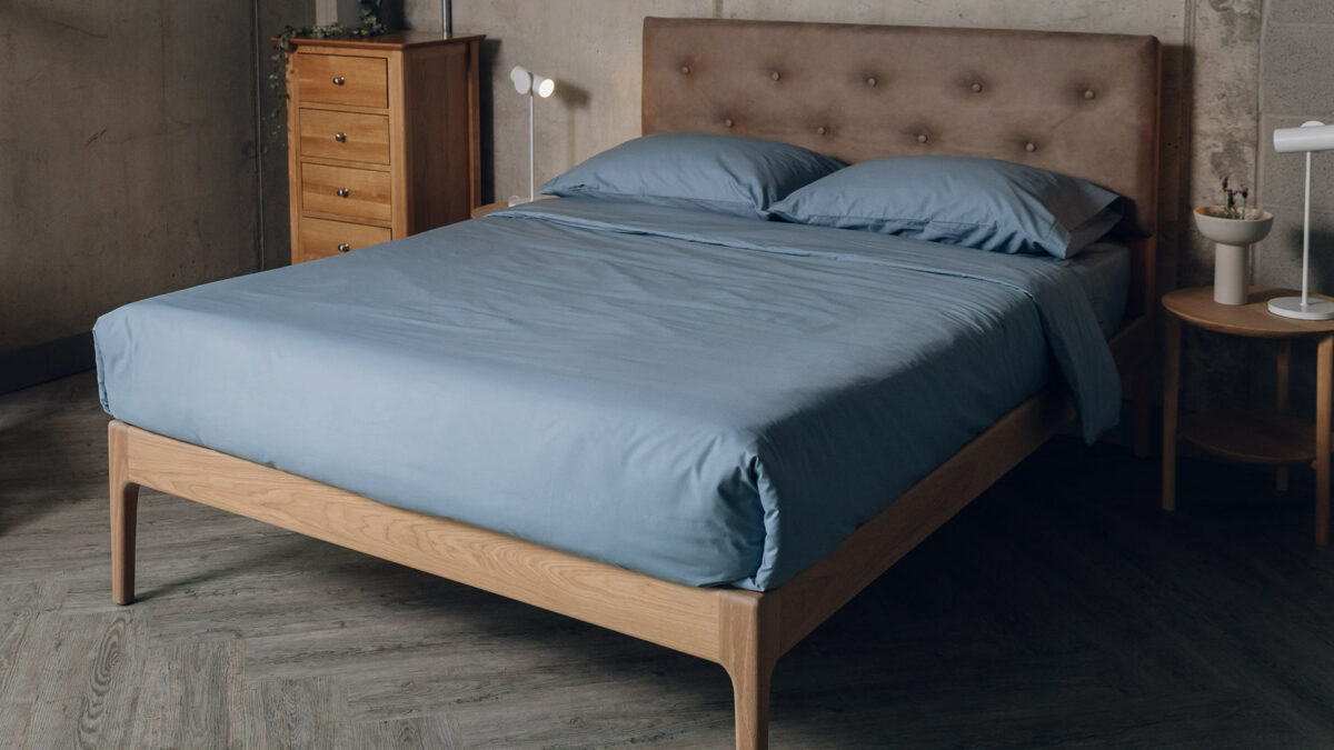 oiled oak Bloomsbury bed with vaquero headboard and blue cotton bedding
