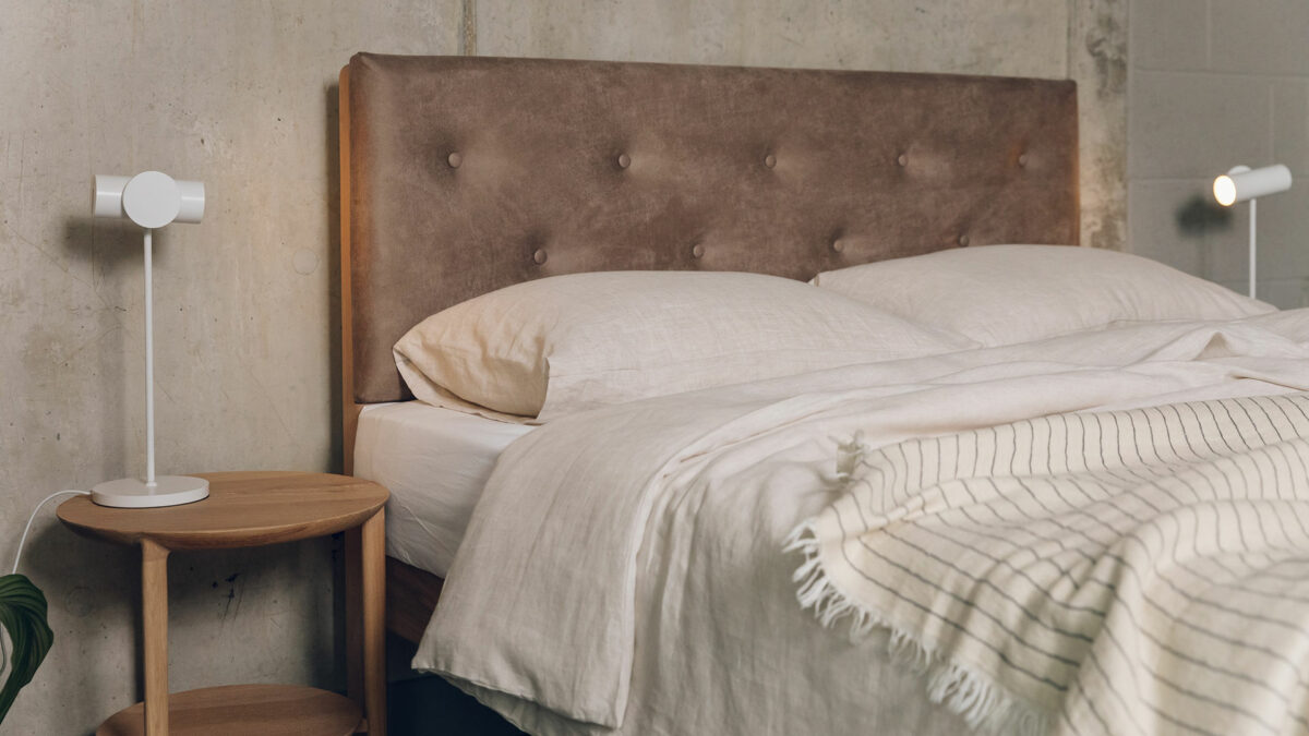 vegan freindly faux leather headboard of the Bloomsbury bed shown with linen bedding