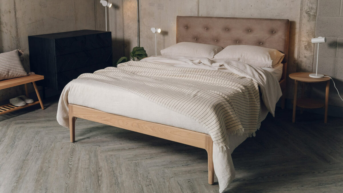 oiled oak bloomsburt with vaquero buttoned headboard with ecru bedding