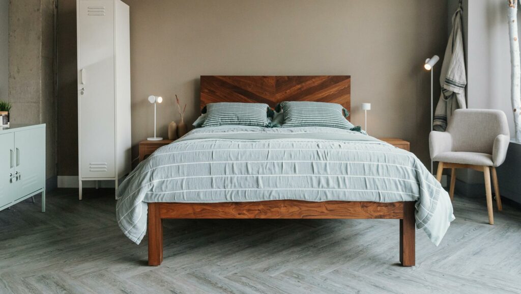oiled walnut Hathersage bed with mint green accessories