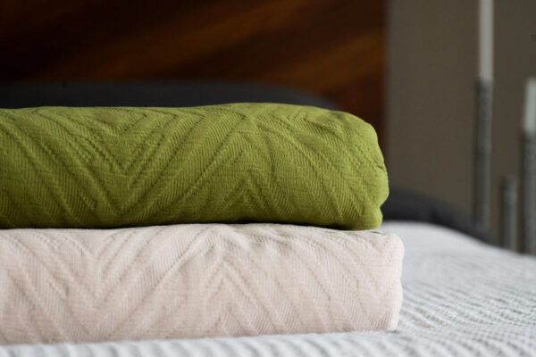 textured bedspreads in blush pink and green