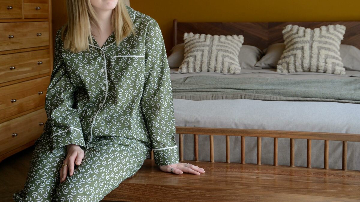 lightweight cotton pjs with a block print leaf design in olive green and white and with contrast edging to the cuffs