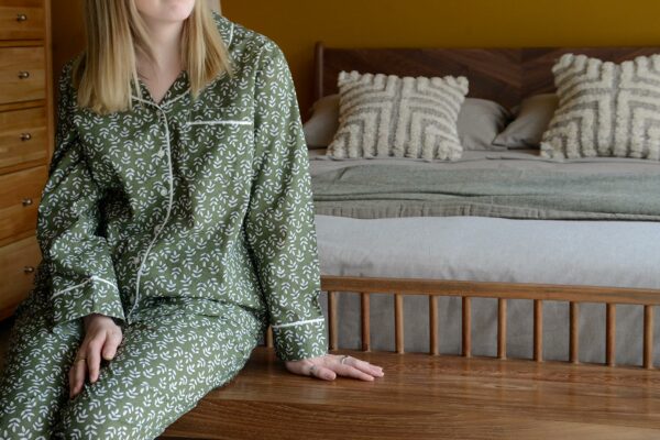 lightweight cotton pjs with a block print leaf design in olive green and white and with contrast edging to the cuffs