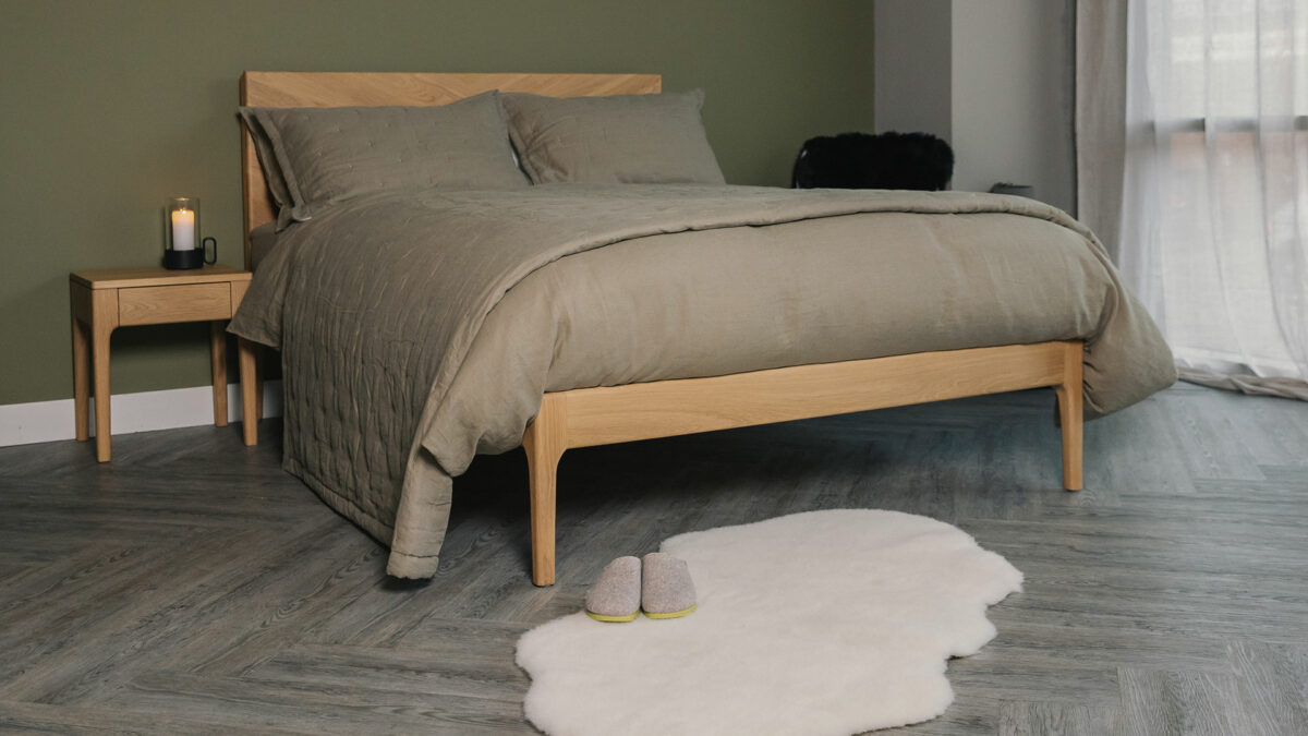 Olive green linen bedding and quilted bedspread sets shown on an Oak Highbury bed