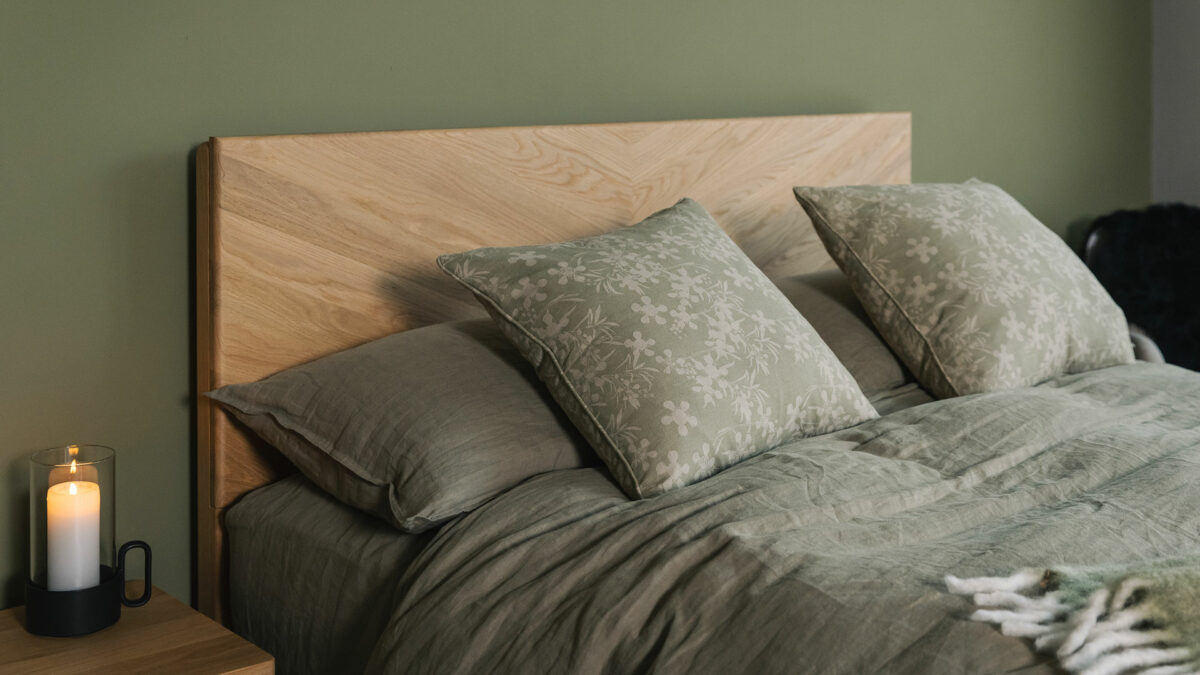 Olive green bedding set shown on an Oak Highbury bed