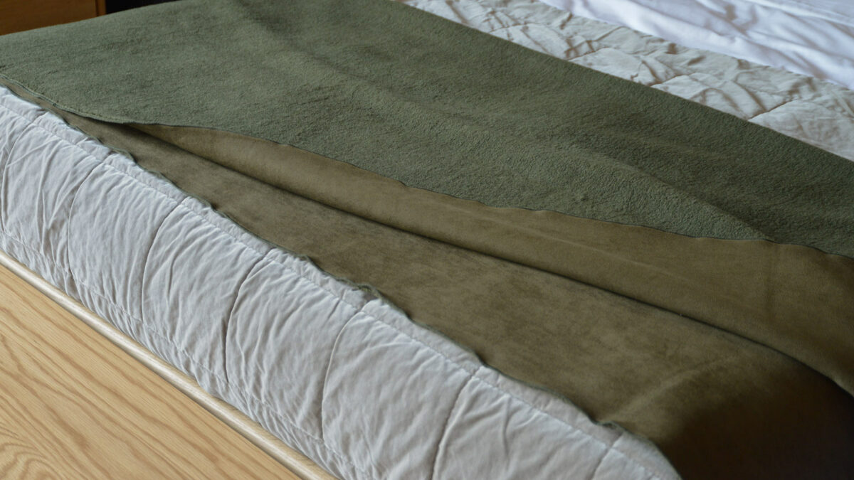 reversible olive green faux sheepskin throw