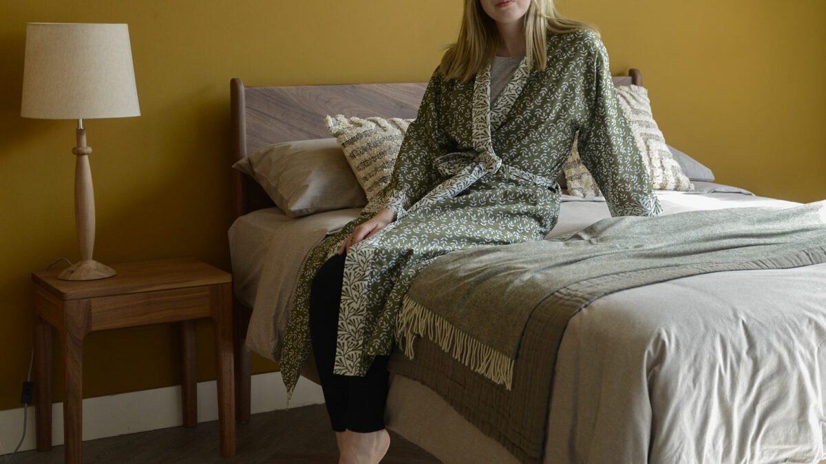 block print light cotton robe with leaf print in olive green and white shown on a model