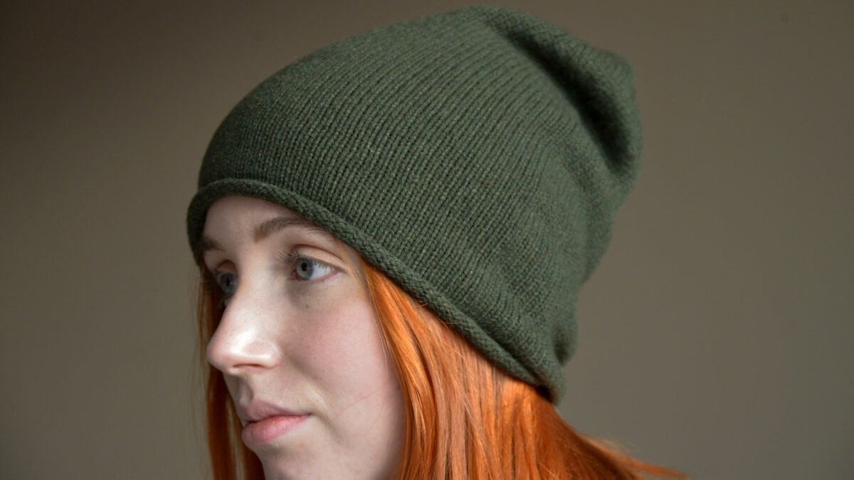 olive green Italian made cashmere beanie hat shown worn